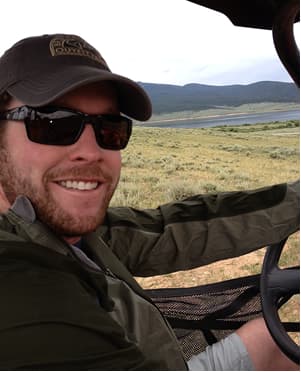 Matt Van Eaton smiling during an outdoor trip